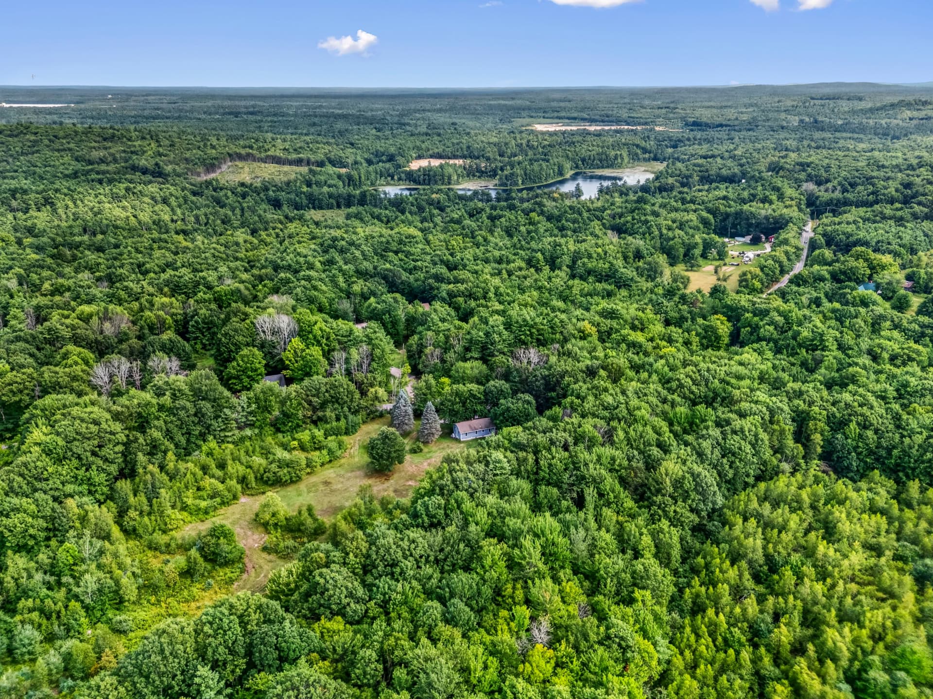 Aerial view of 598 Cape Road and its 5-acre wooded lot in Limington, Maine